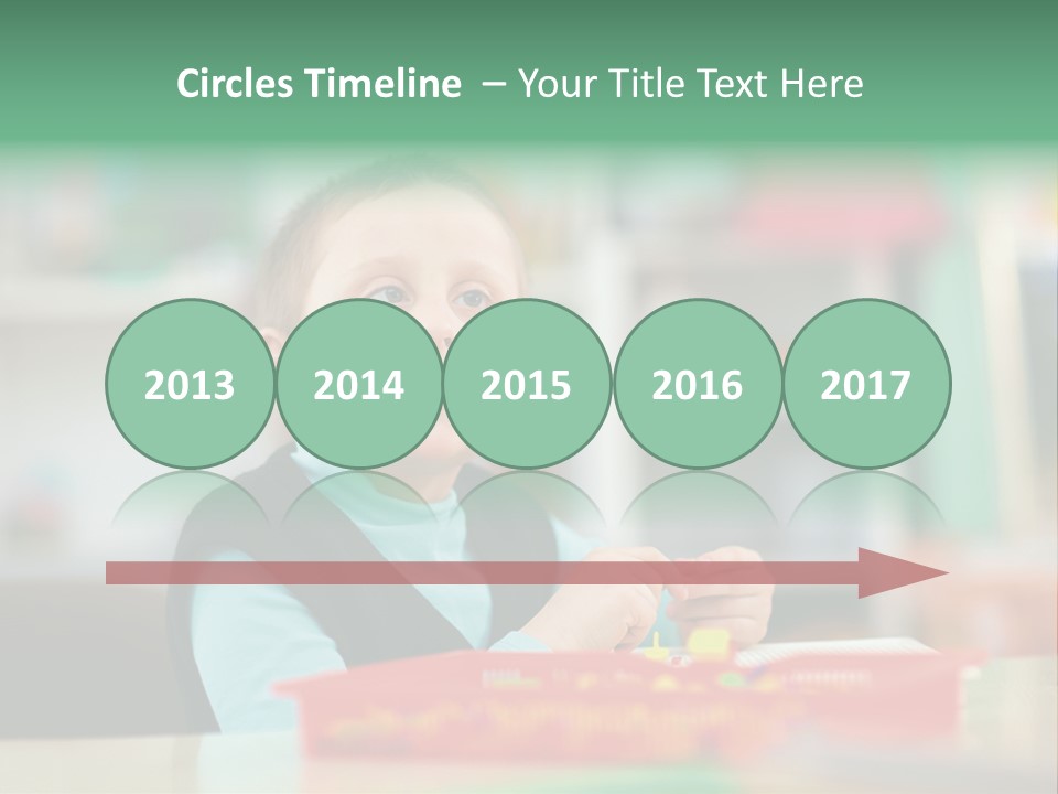 A Young Boy Is Sitting At A Table PowerPoint Template