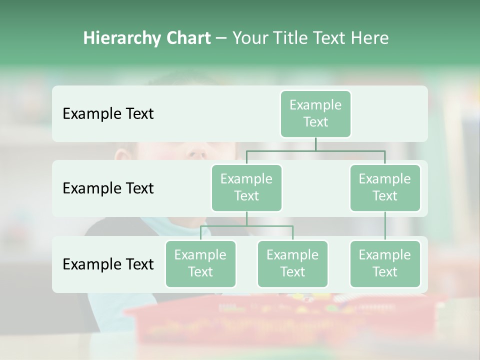 A Young Boy Is Sitting At A Table PowerPoint Template