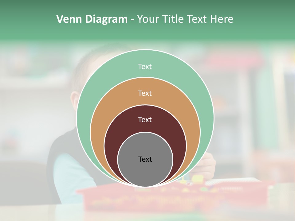 A Young Boy Is Sitting At A Table PowerPoint Template