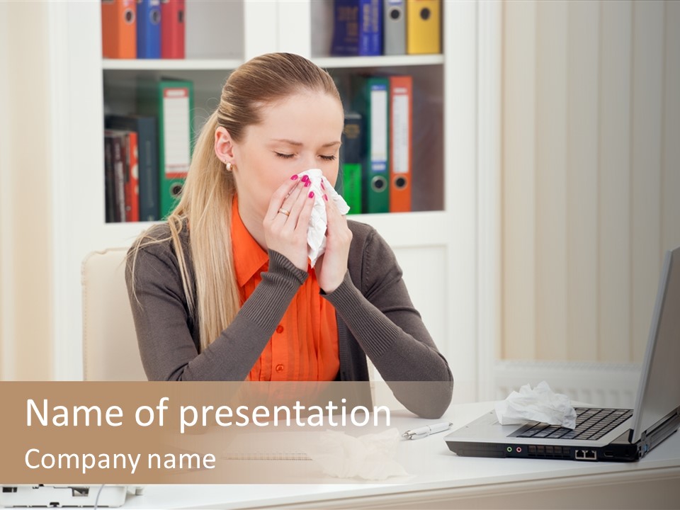 A Woman Sitting At A Desk Blowing Her Nose PowerPoint Template