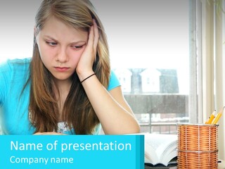 A Girl Sitting At A Desk With A Book And Pen PowerPoint Template