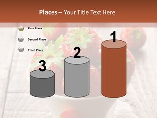 A Bowl Of Strawberries On A Wooden Table PowerPoint Template