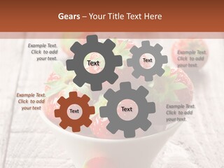 A Bowl Of Strawberries On A Wooden Table PowerPoint Template