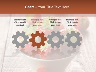 A Bowl Of Strawberries On A Wooden Table PowerPoint Template