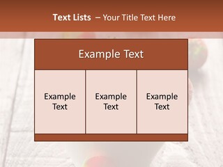 A Bowl Of Strawberries On A Wooden Table PowerPoint Template