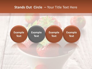 A Bowl Of Strawberries On A Wooden Table PowerPoint Template