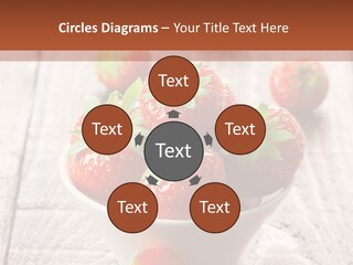 A Bowl Of Strawberries On A Wooden Table PowerPoint Template