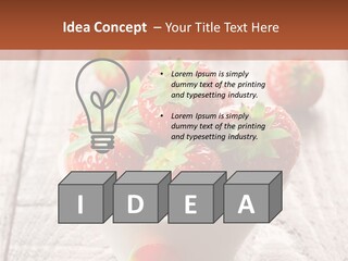A Bowl Of Strawberries On A Wooden Table PowerPoint Template