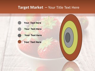 A Bowl Of Strawberries On A Wooden Table PowerPoint Template