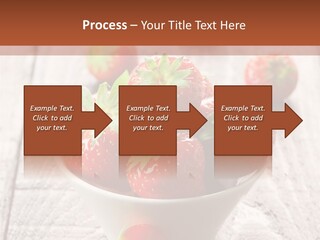 A Bowl Of Strawberries On A Wooden Table PowerPoint Template