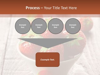 A Bowl Of Strawberries On A Wooden Table PowerPoint Template