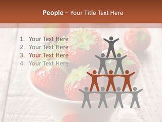 A Bowl Of Strawberries On A Wooden Table PowerPoint Template