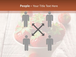 A Bowl Of Strawberries On A Wooden Table PowerPoint Template