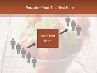 A Bowl Of Strawberries On A Wooden Table PowerPoint Template
