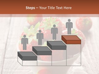 A Bowl Of Strawberries On A Wooden Table PowerPoint Template