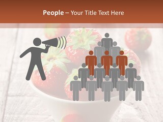 A Bowl Of Strawberries On A Wooden Table PowerPoint Template