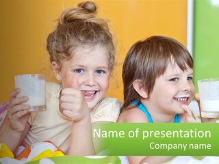 Two Little Girls Sitting On A Bed With A Glass Of Milk PowerPoint Template