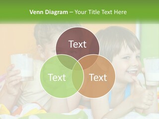Two Little Girls Sitting On A Bed With A Glass Of Milk PowerPoint Template