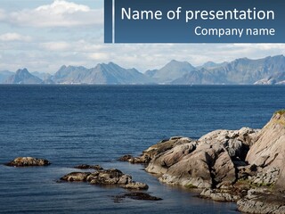 A Large Body Of Water Surrounded By Mountains PowerPoint Template