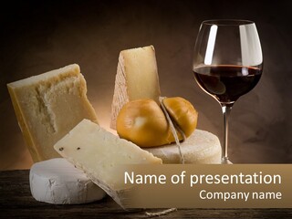 A Glass Of Wine, Cheese And Bread On A Table PowerPoint Template
