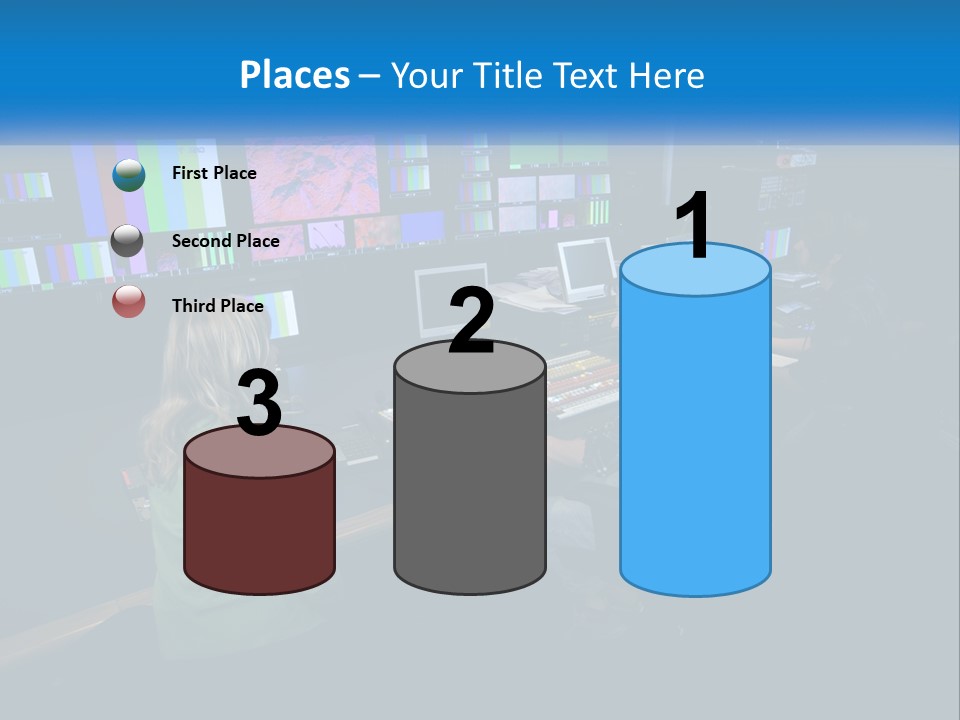 A Group Of People Sitting At A Desk With Computers PowerPoint Template