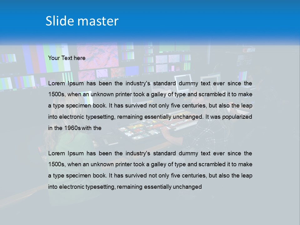 A Group Of People Sitting At A Desk With Computers PowerPoint Template