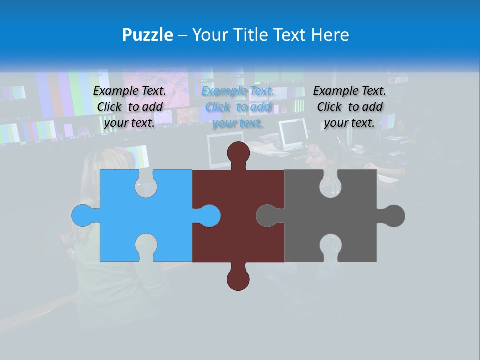 A Group Of People Sitting At A Desk With Computers PowerPoint Template