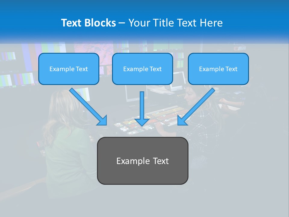 A Group Of People Sitting At A Desk With Computers PowerPoint Template