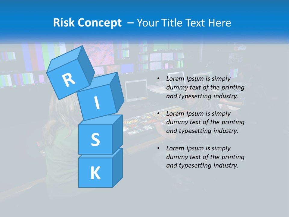 A Group Of People Sitting At A Desk With Computers PowerPoint Template