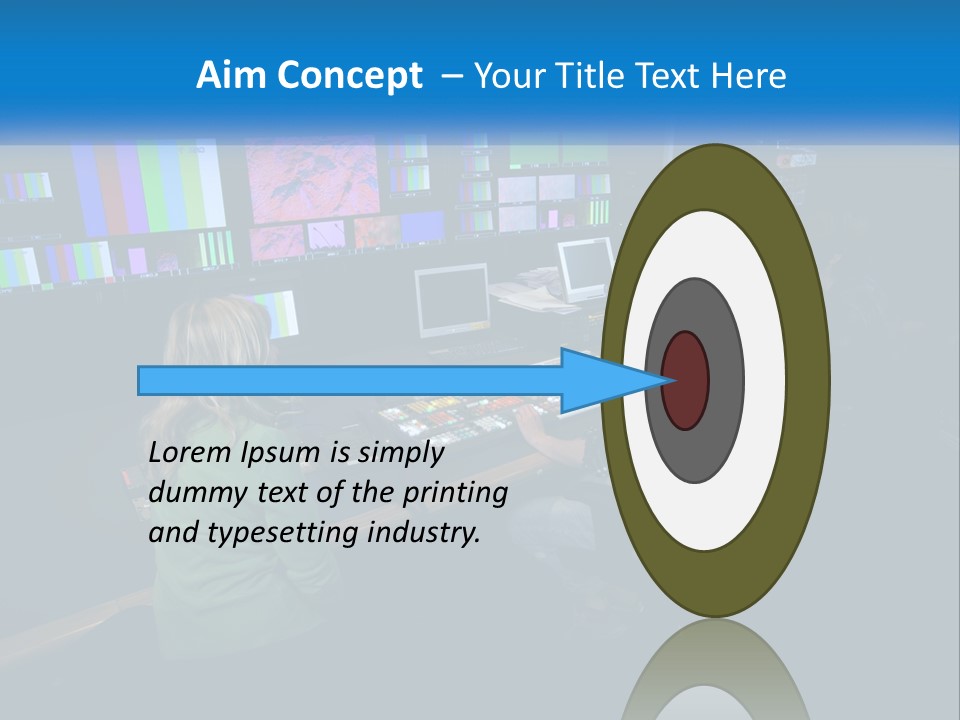 A Group Of People Sitting At A Desk With Computers PowerPoint Template