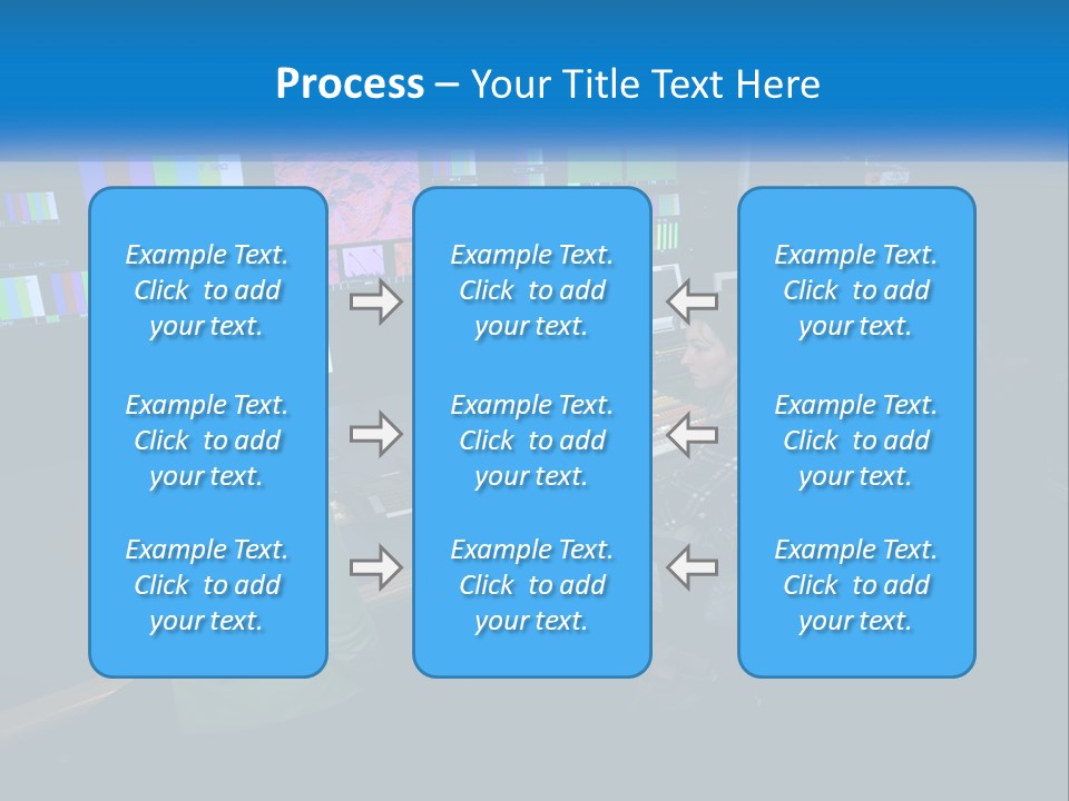 A Group Of People Sitting At A Desk With Computers PowerPoint Template