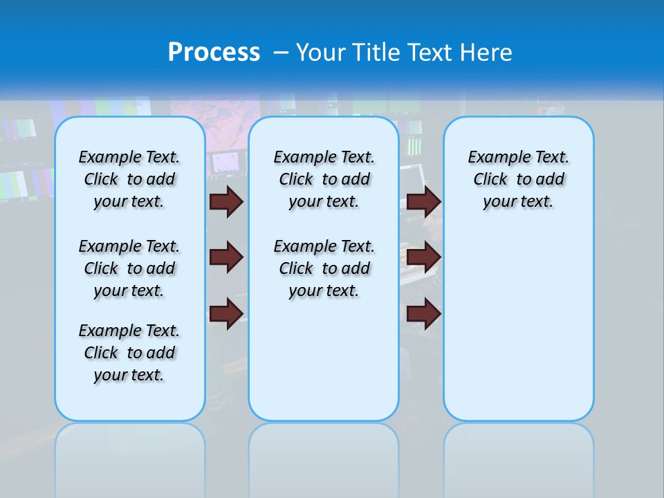 A Group Of People Sitting At A Desk With Computers PowerPoint Template