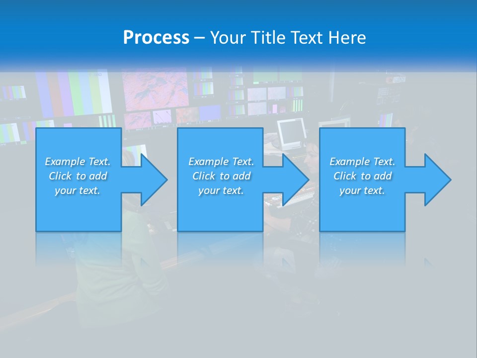 A Group Of People Sitting At A Desk With Computers PowerPoint Template