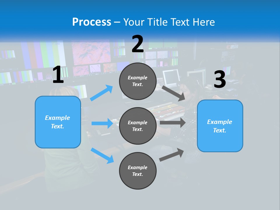 A Group Of People Sitting At A Desk With Computers PowerPoint Template