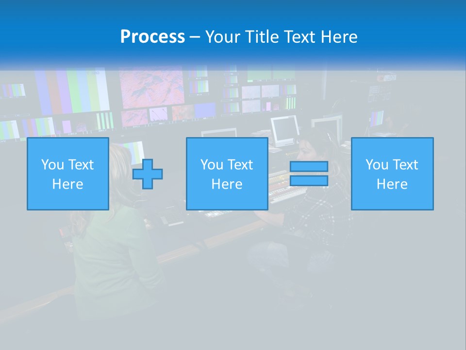 A Group Of People Sitting At A Desk With Computers PowerPoint Template