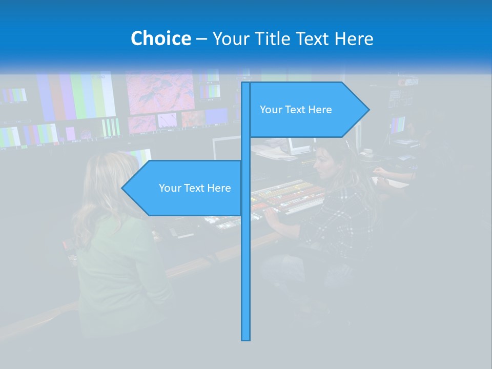A Group Of People Sitting At A Desk With Computers PowerPoint Template