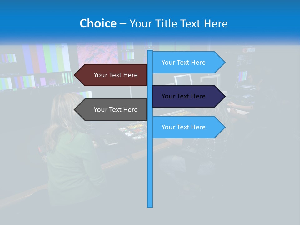A Group Of People Sitting At A Desk With Computers PowerPoint Template