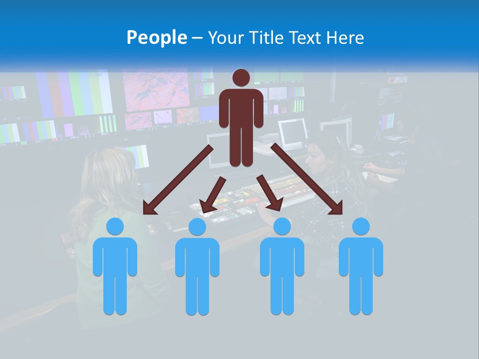 A Group Of People Sitting At A Desk With Computers PowerPoint Template