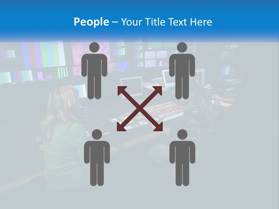 A Group Of People Sitting At A Desk With Computers PowerPoint Template