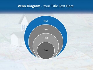 A Small Model House Sitting On Top Of A Map PowerPoint Template