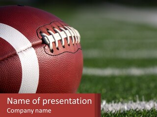 A Football Sitting On Top Of A Field PowerPoint Template