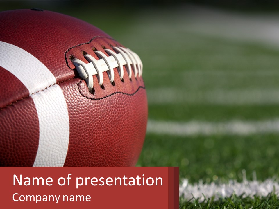 A Football Sitting On Top Of A Field PowerPoint Template