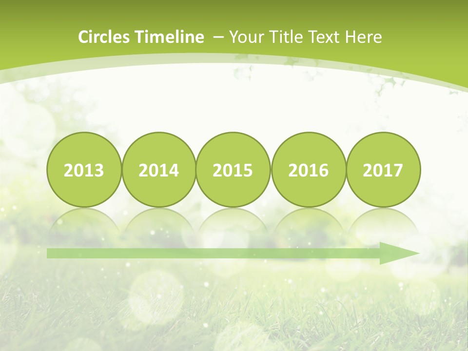 A Green Grass Field With A Tree In The Background PowerPoint Template