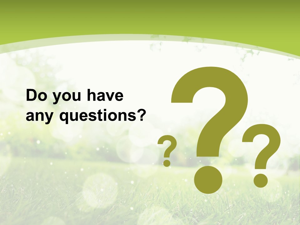 A Green Grass Field With A Tree In The Background PowerPoint Template