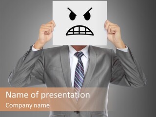 A Man In A Suit Holding A Paper With A Sad Face On It PowerPoint Template