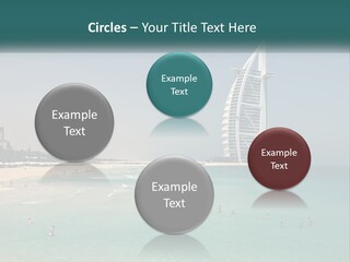A Picture Of A Beach With A Very Tall Building In The Background PowerPoint Template