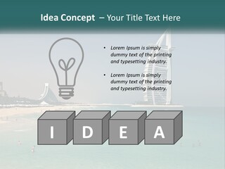 A Picture Of A Beach With A Very Tall Building In The Background PowerPoint Template