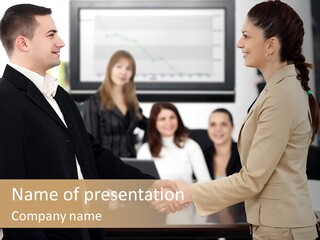 Two People Shaking Hands In Front Of A Group Of People PowerPoint Template