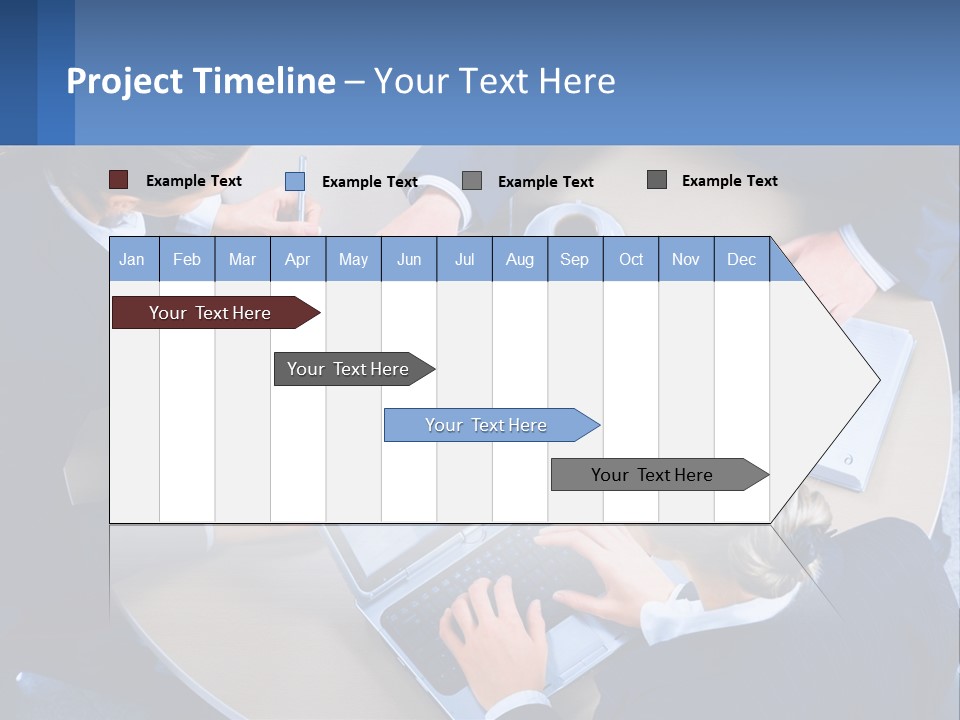 A Group Of People Sitting Around A Table Working On A Laptop PowerPoint Template