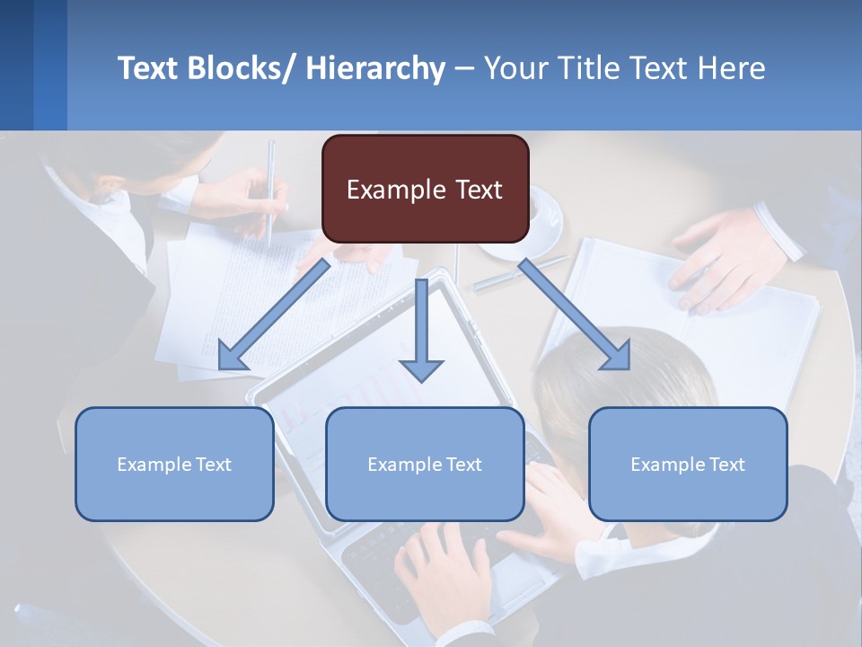 A Group Of People Sitting Around A Table Working On A Laptop PowerPoint Template